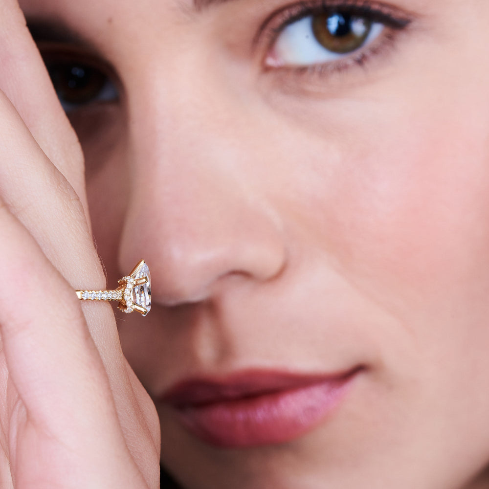 oval cut arc hidden halo engagement ring