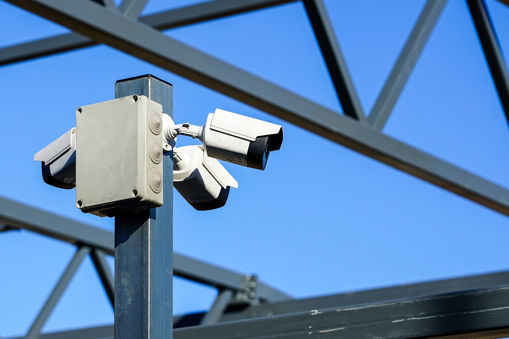 A,Pillar,With,Three,Surveillance,Cameras,On,The,Construction,Site