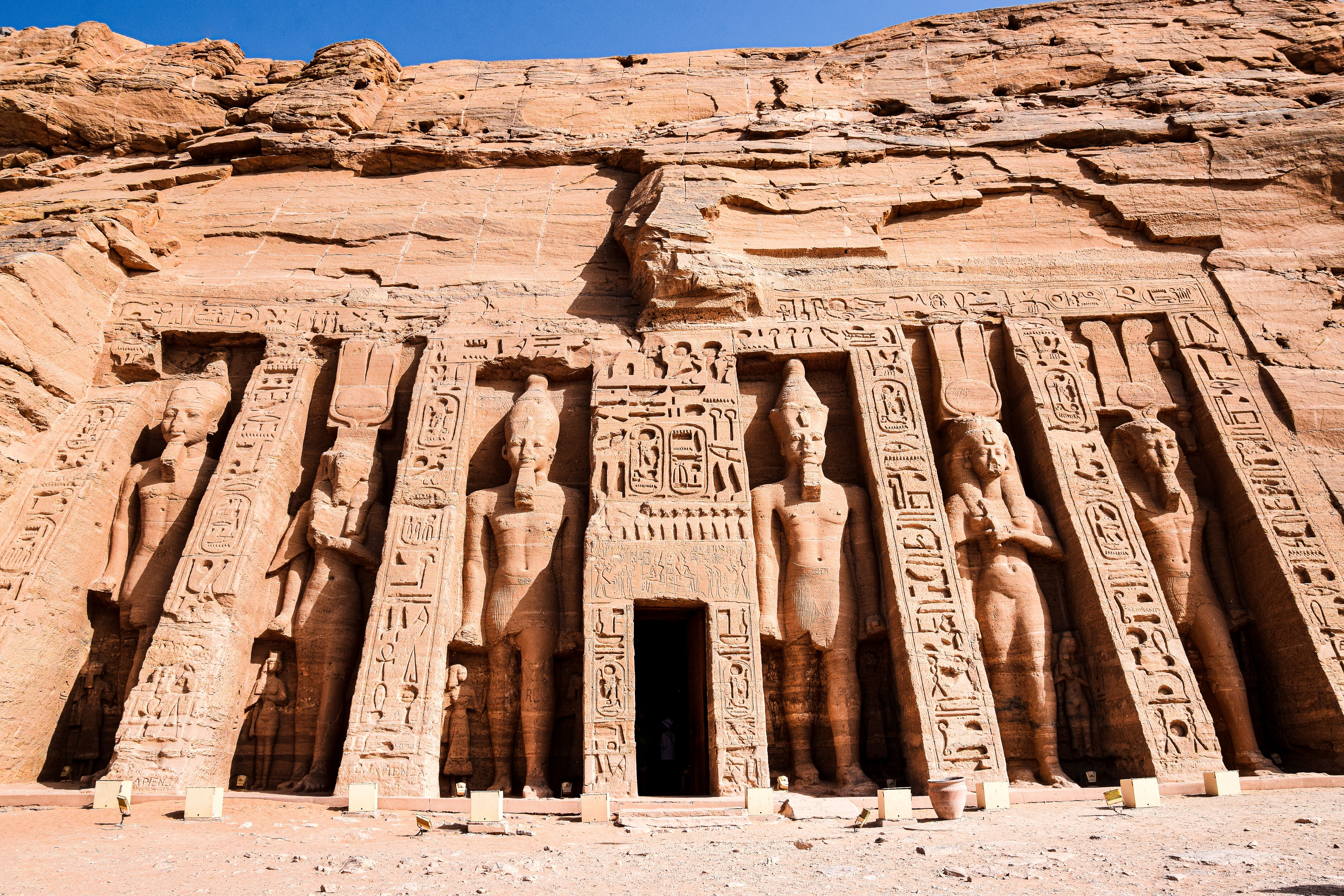 Monumental carved statues at the entrance to Abu Simbel, one of Egypt's ancient temples.