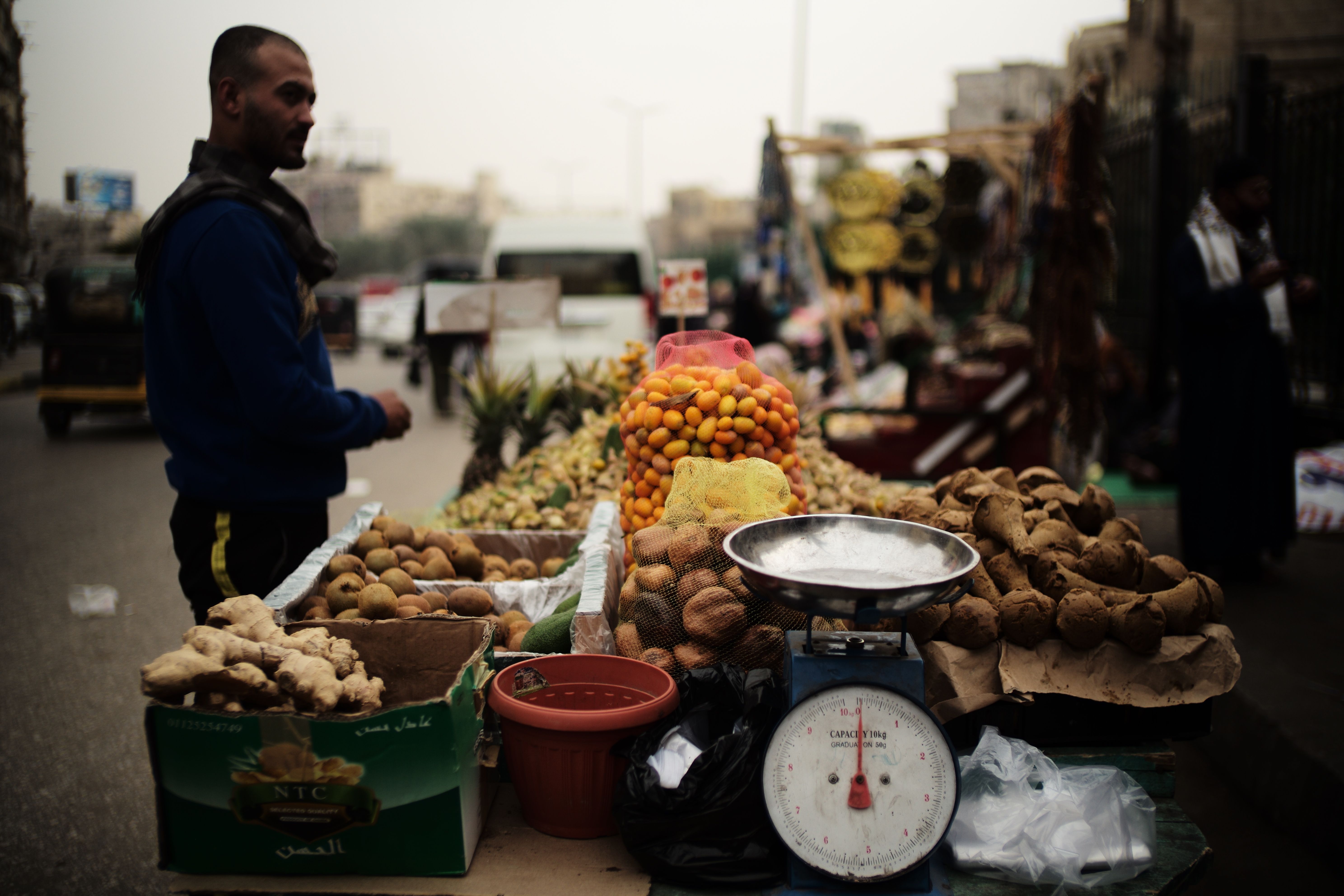 A bustling Cairo market stall with fresh produce and local commerce.